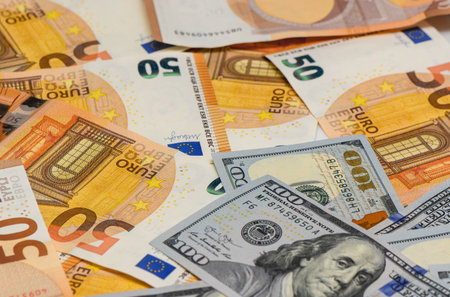 Background of 100 USD and 50 EUR banknotes symbolizing forex exchange, world trade, global economy,...