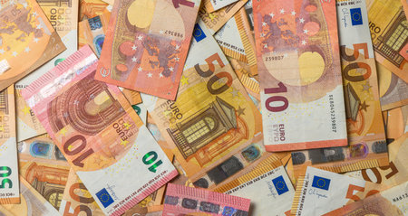 Close view of euro currency banknotes 10, 20, and 50 showing design details, symbolizing European...