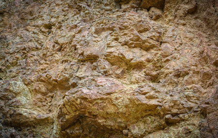 Macro view of natural mountain stone texture. Rough rocky surface with detailed patterns, perfect...