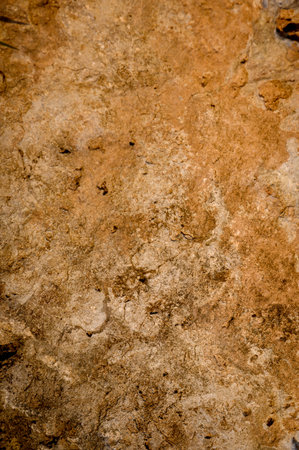 Close-up of a yellow rock situated in a mountainous terrain, perfect for nature, geology, and...