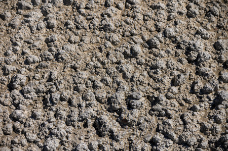 A rugged frozen concrete texture, ideal as a versatile background for industrial and modern design photography.の写真素材