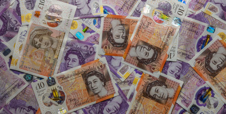 Euro banknotes of various denominations arranged as a pattern, perfect for financial, banking, and...