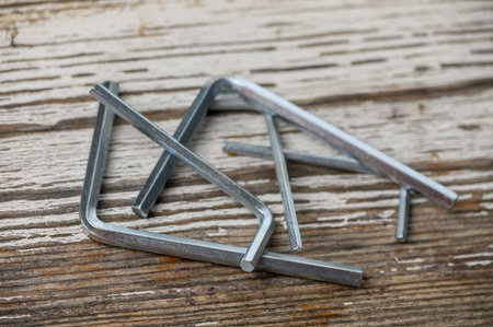 Small hex key Allen wrench set arranged on a table, perfect for DIY, home repair, and workshop tool photography.の写真素材