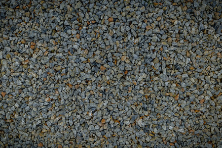 Smooth stones on the beach, natural texture and patterns, ideal for backgrounds, design, and nature...