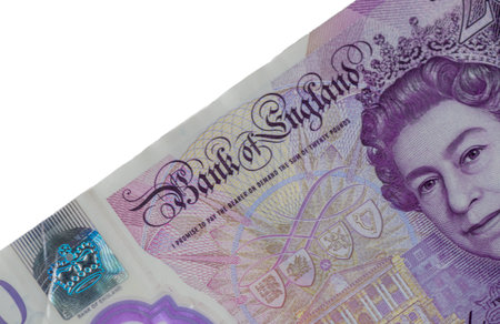 Fragments of 20 pound sterling banknote showing security details.の写真素材