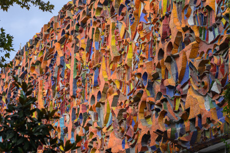 Fragment of Soviet mosaic with bright colorful tiles on a wall, creating a striking retro background for design, graphics, and interiors.の写真素材