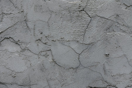 Background of an old plastered wall with cracks and scratches. Perfect texture for design projects,...