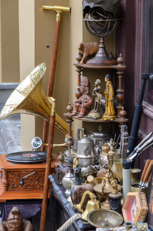 Street trade in antiques and vintage items in Tbilisi, Georgia. Stalls with retro objects, books, paintings, dishes, and souvenirs create the charming atmosphere of the old town and a flea market.の写真素材