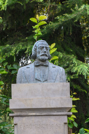 The statue of Marie Felicite, writer, historian, and public figure, is located in a Tbilisi park. Surrounded by trees and flowers, it reflects the citys cultural and historical heritage.の写真素材