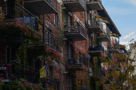 Red brick house in a residential complex, showing architecture, urban environment, and neighborhood context, ideal for city projects.の写真素材