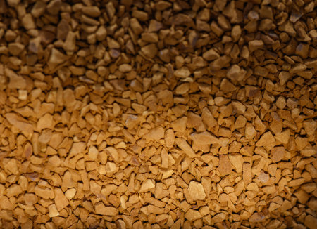 Close-up of many instant coffee granules. Rich texture and warm brown color, ideal for food photography, advertising, and design backgrounds.の写真素材