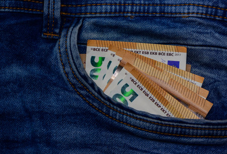 50 euro currency notes in jeans pocket. Cash concept for finance, personal savings, and money stock...