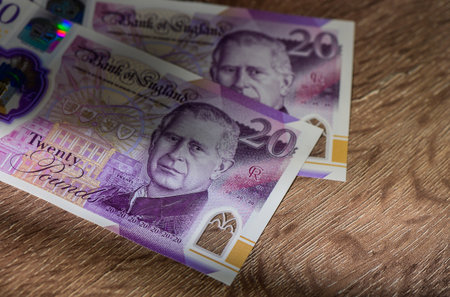 Close-up of King Charles III portrait on 20 pound sterling banknote. Currency, money, and finance concept for stock photography and financial illustrations.の写真素材