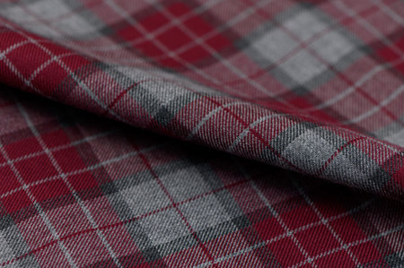 Close-up of tartan with dense thread weave in green, yellow, and black shades. Rough texture and clear checks form a classic background for traditional bags and interior elements.の写真素材