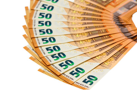 Beautiful radial fan arrangement of 50 euro banknotes creating stunning circular composition on pure white background. Perfect for premium financial concepts.の写真素材
