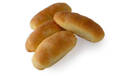 High-resolution studio photograph of traditional Latvian pastries filled with lard, isolated on a...