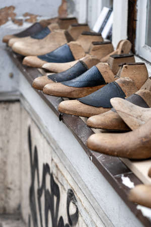 Row Of Old Wood And Leather Shoe Trees Or Shoe Shapers, Portrait Orientationの写真素材