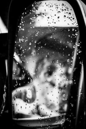 A Blurred Reflection In A Wing Mirror Of Children Pretending To Drive, Portrait Orientationの写真素材