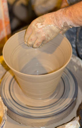 Artisanal pottery and earthwork by handの写真素材