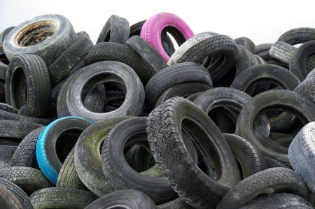Heap of used car tires in a factory for recyclingの写真素材
