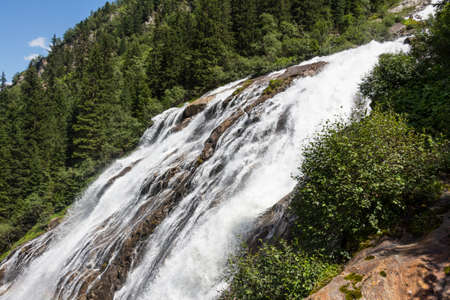 Waterfall in the mountainsの写真素材