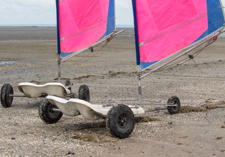 Sand yachting on a beach at low tideの写真素材