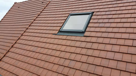 Red roof tile and windowの写真素材
