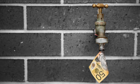 A brass outdoor tap or faucet with a 50 dollar note coming out of it like water. Black and white...