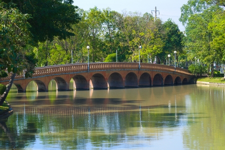 Lovely bridge in a beautifully landscaped park in Bangkok, Thailand.の写真素材