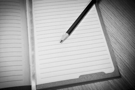 black and white portrait have pencil on notebook paper backgroundの写真素材