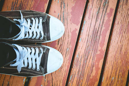 Old black shoes  on the wood floor.の写真素材