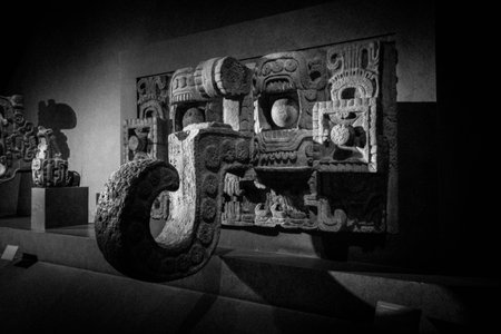 This impressive carved stone, from the ancient Maya civilization, evokes the power and mystery of an ancient guardian creatureの写真素材