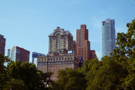A striking view of the New York Film Academy building in Lower Manhattan, surrounded by a mix of historic and modern skyscrapersの写真素材