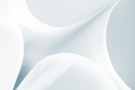 an abstract macro photo of curve shapes made up of white paperの写真素材