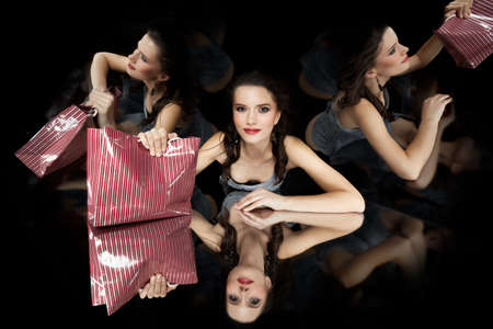 brunette girl shopping bag kaleidoscope mirrors smilingの写真素材