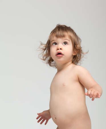 little preescolar looking up surprised blank spaceの写真素材