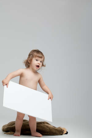 cute child with blanck board for advertising の写真素材