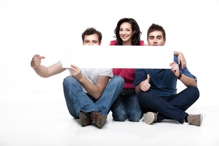 group of friends showing blank bannerの写真素材