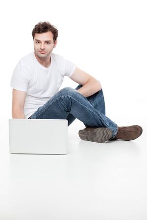 man sitting behind laptopの写真素材