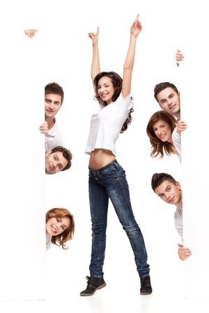 enthusiastic young woman between white boards friendsの写真素材