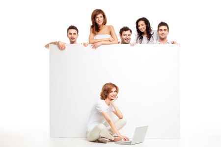 friends group showing blank banner woman laptopの写真素材