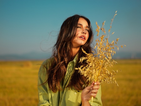 beautiful woman enjoying summer sunset eyes closed