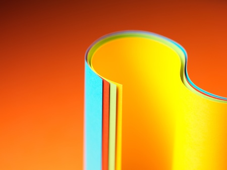 graphic macro image of colorful origami pattern made of curved sheets of paper