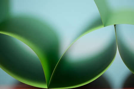 graphic abstract image of colorful origami pattern made of curved sheets of paperの写真素材