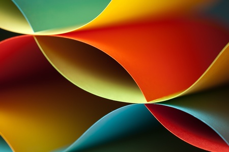 graphic abstract image of colorful origami pattern made of curved sheets of paperの写真素材