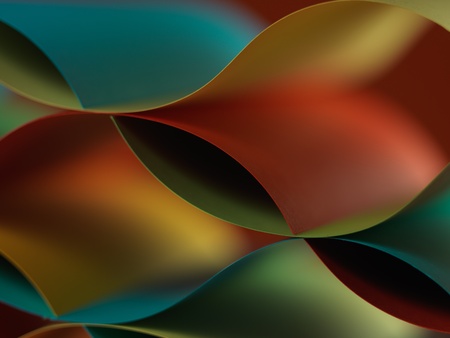 graphic macro image of colorful origami pattern made of curved sheets of paper