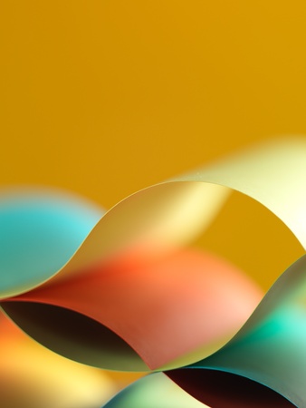background macro image of colorful origami pattern made of curved sheets of paper