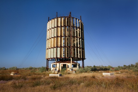 old, rusted windmill in dusty, abandoned landscapeの写真素材
