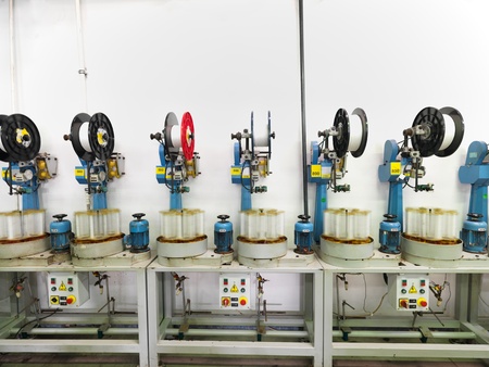 detail of an indoor industrial production line, in a thread factoryの写真素材