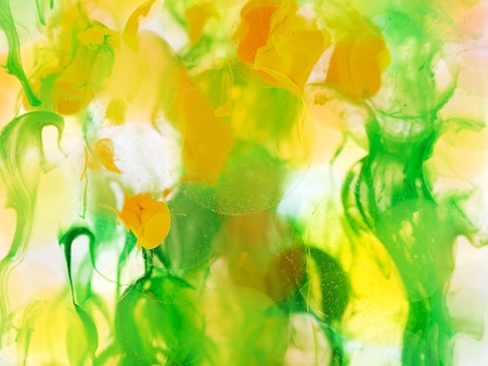 transparent ball under water, green yellow ink colors combined